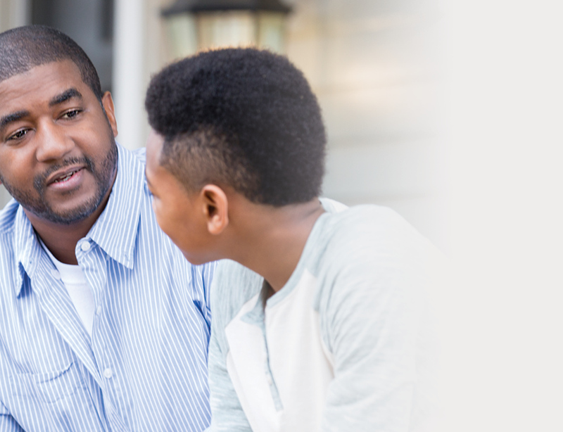 teenager talking to his father