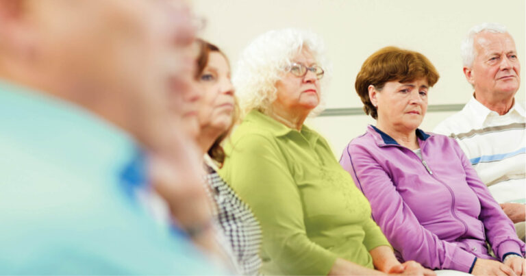group of mournful attendees at a bereavement support session