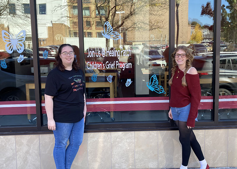 Sheetz Fellows participants Jocelyn Carles and Hollie Keller next to the Curry Building