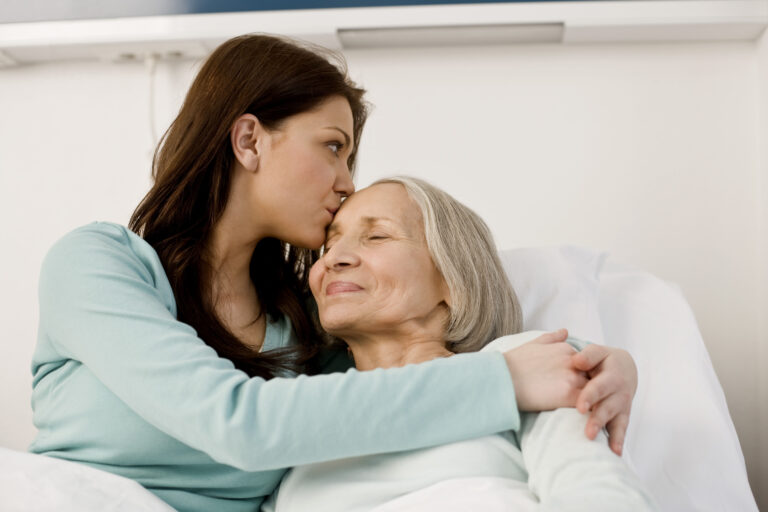 woman embracing an older woman