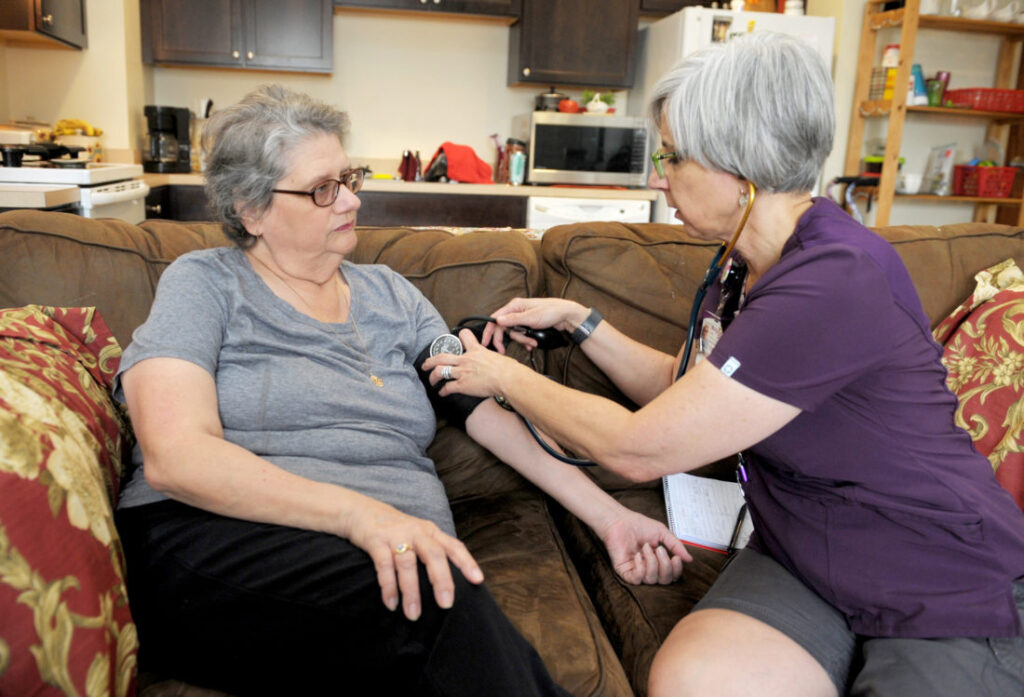 home nurse taking care of a patient
